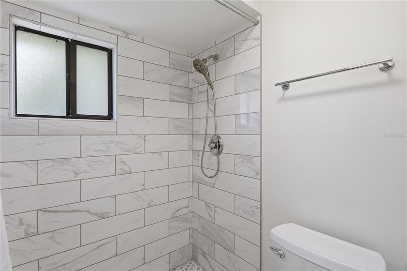Welcome to this beautifully renovated second-floor condo in the - photo 22