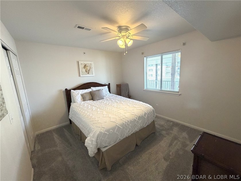 Indulge in stunning lake views from this remarkable 3-bedroom - photo 13