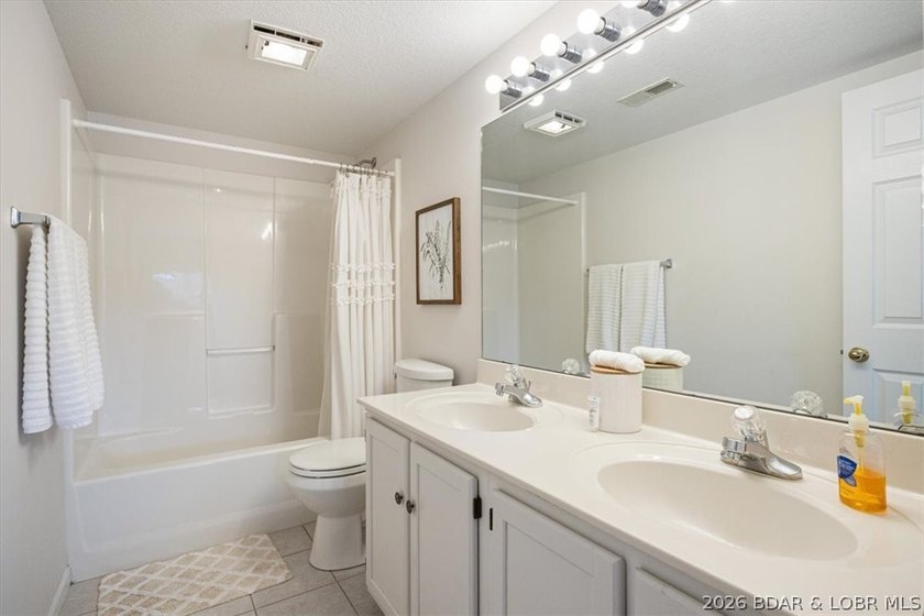 Indulge in stunning lake views from this remarkable 3-bedroom - photo 14