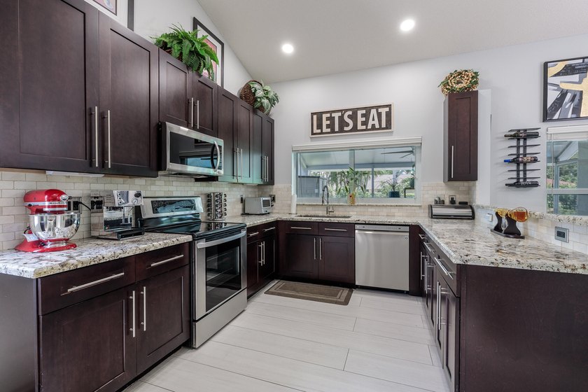 Step into this immaculate, model-like 3BR/2BA home with a den in - photo 13