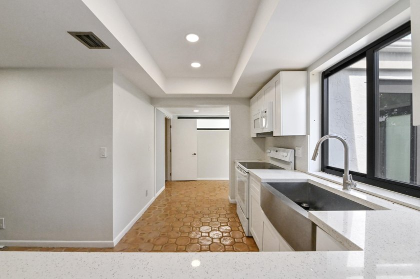 Corner unit villa features 2 bed, 2 bath, large den (could be a - photo 13