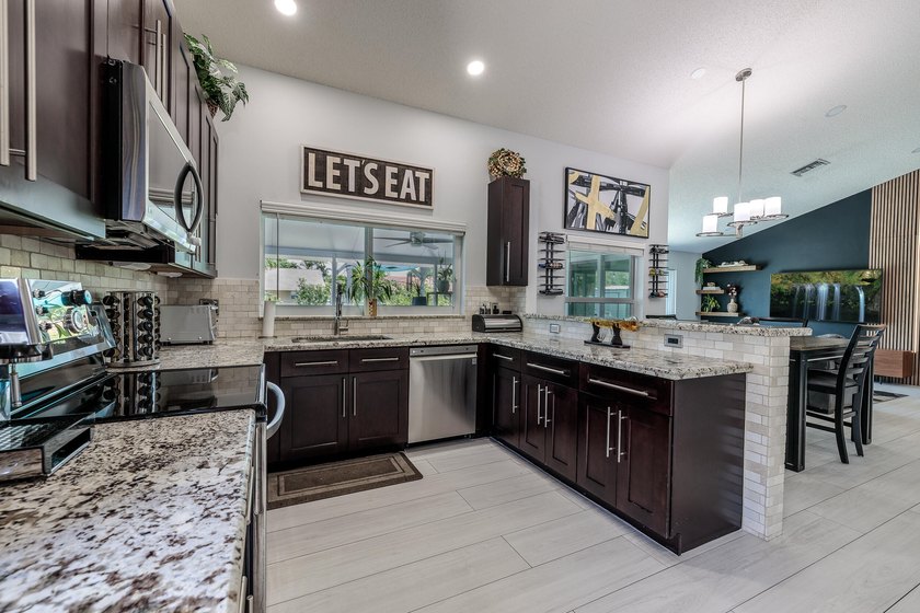 Step into this immaculate, model-like 3BR/2BA home with a den in - photo 14