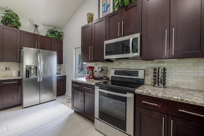 Step into this immaculate, model-like 3BR/2BA home with a den in - photo 15