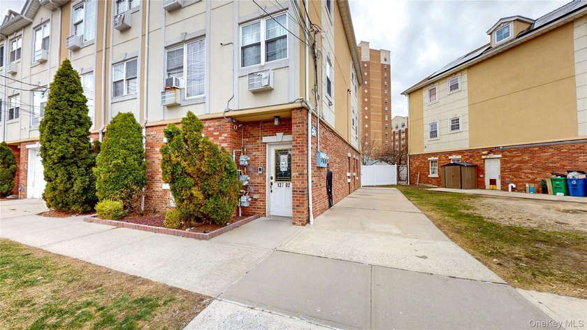 This beautifully maintained legal 3-family semi-detached home - photo 3