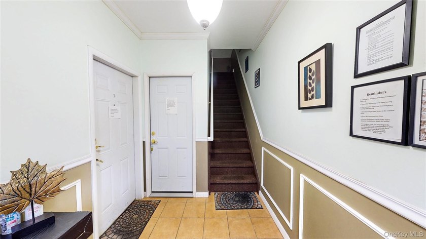 This beautifully maintained legal 3-family semi-detached home - photo 4
