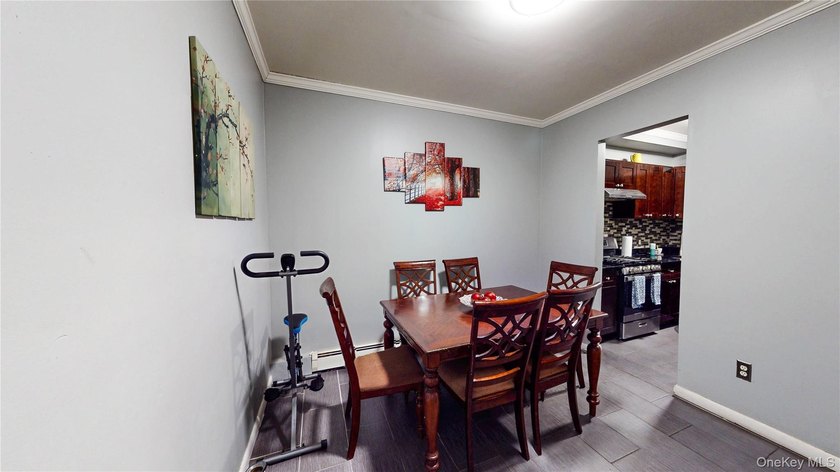 This beautifully maintained legal 3-family semi-detached home - photo 6