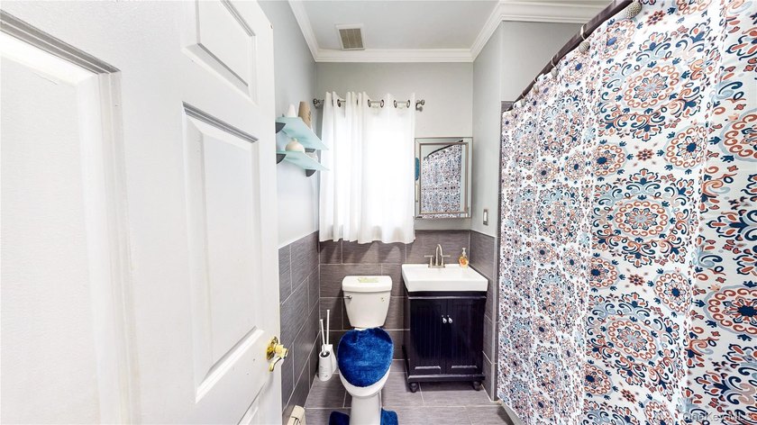 This beautifully maintained legal 3-family semi-detached home - photo 8