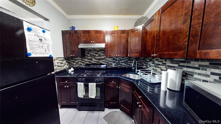 This beautifully maintained legal 3-family semi-detached home - photo 10