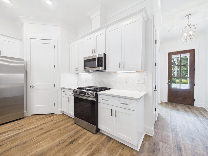 This spacious single-story residence offers a seamless blend of - photo 15
