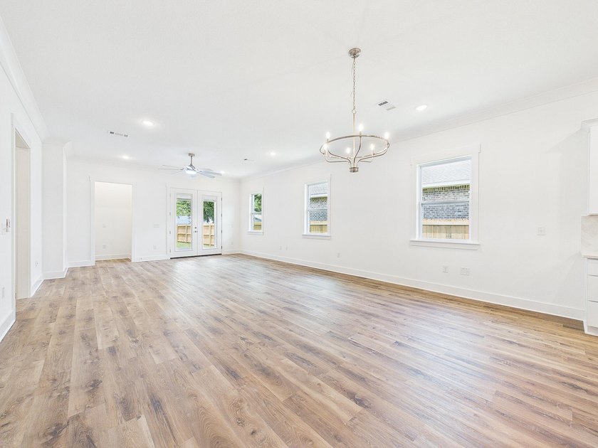 This spacious single-story residence offers a seamless blend of - photo 19