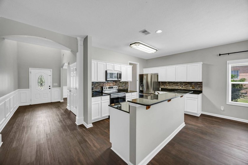 Stunning all brick home with exceptional curb appeal, featuring - photo 13