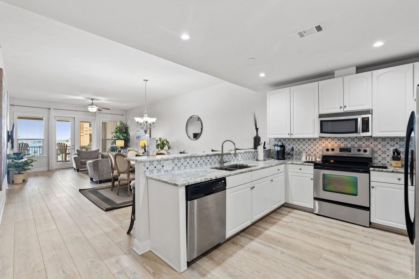 Set against the sparkling waters of Lake LBJ, this turn-key - photo 6