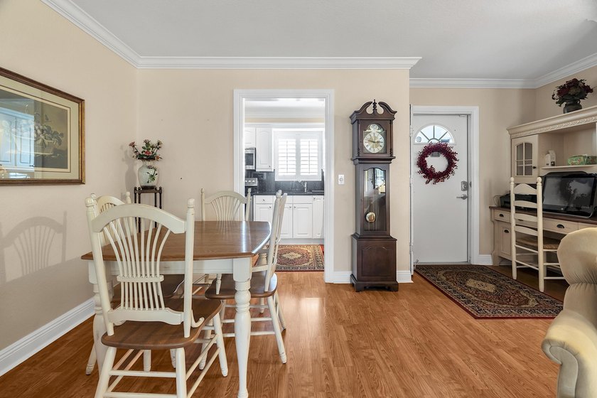 Welcome to this beautifully updated villa, featuring a spacious - photo 12