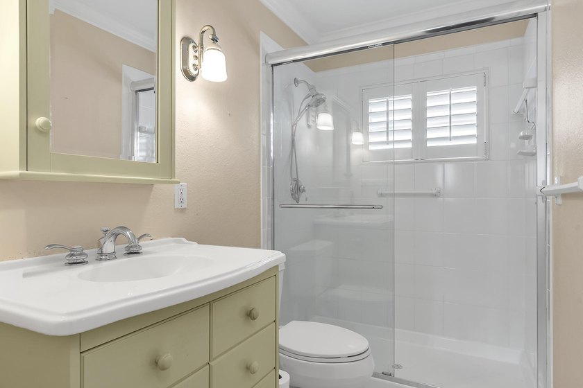 Welcome to this beautifully updated villa, featuring a spacious - photo 26