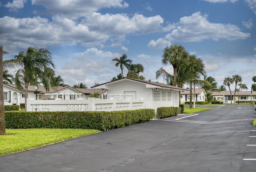 Welcome to this beautifully updated villa, featuring a spacious - photo 32