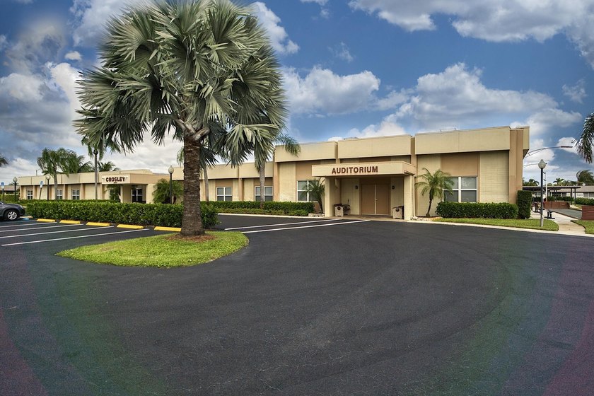 Welcome to this beautifully updated villa, featuring a spacious - photo 36