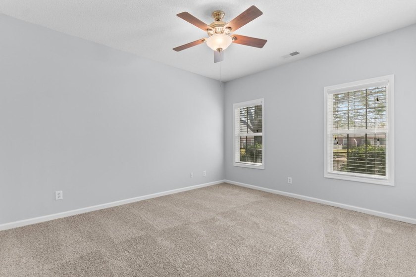 Tucked along a peaceful pond in the Lighthouse Pointe at - photo 15