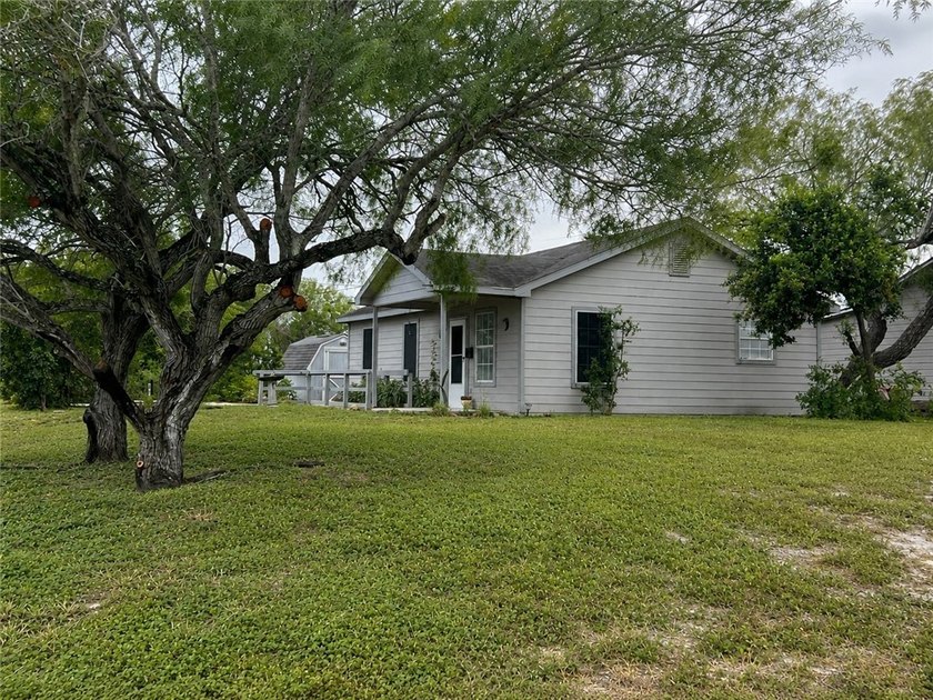 Nestled on a spacious corner lot, this charming 3-bedroom - photo 3