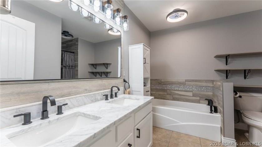 Experience lake living at its best in this beautifully updated - photo 12