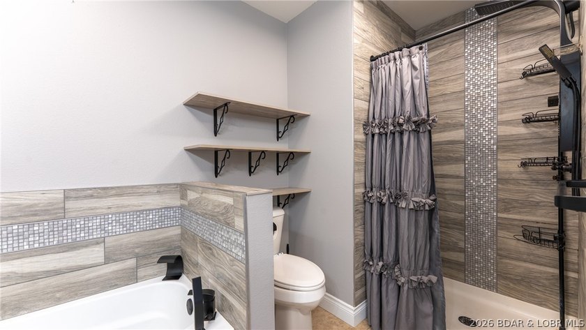 Experience lake living at its best in this beautifully updated - photo 13