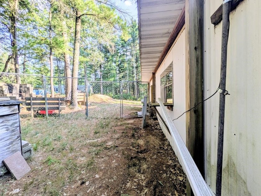 Quiet and peaceful!! This 2 bedroom single wide mobile home is - photo 14