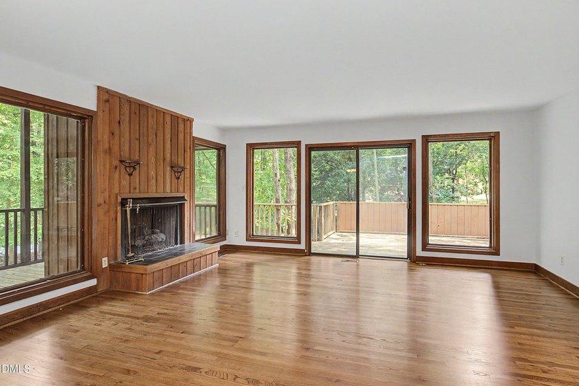 Tucked away on a sprawling corner lot of over 1/2 an acre in the - photo 8