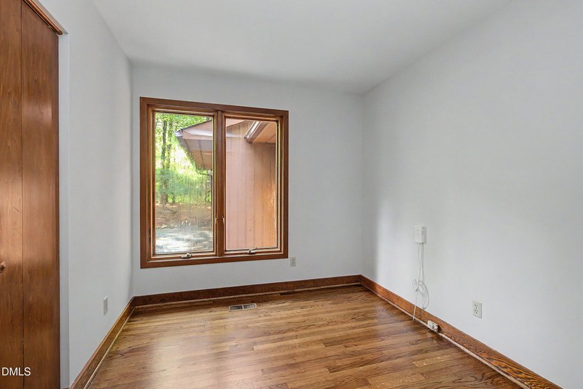Tucked away on a sprawling corner lot of over 1/2 an acre in the - photo 10
