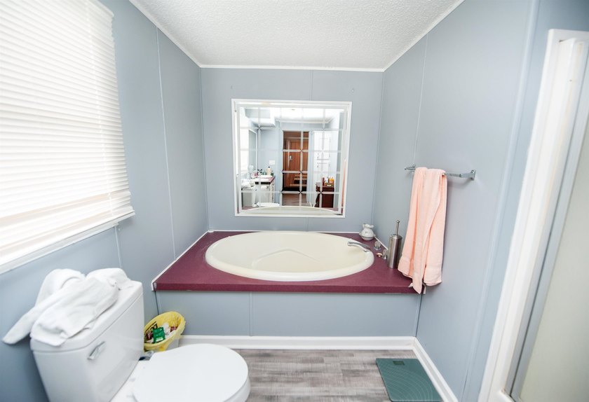 This 3 bedroom, 2 bath manufactured home is on a level .60 acre - photo 15