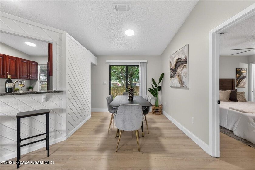 Welcome home to this charming 3-bedroom, 2-bath residence with a - photo 8