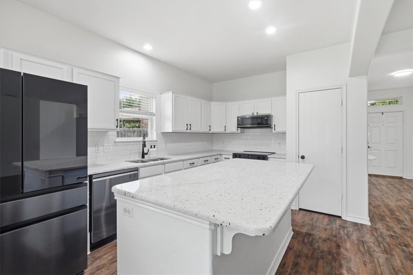 NEWLY renovated four-bedroom,two-bathroom split-plan home with - photo 8