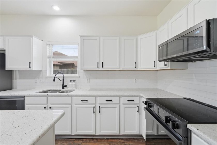 NEWLY renovated four-bedroom,two-bathroom split-plan home with - photo 10