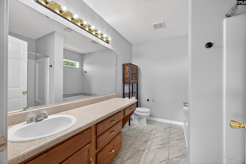 Welcome home to this beautifully updated 4-bedroom, 2.5-bath - photo 26