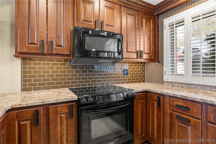 Experience tranquil lakeside living in this luxurious 3BR/3BA - photo 13