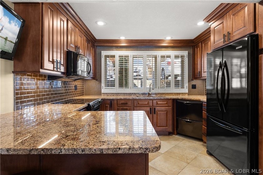 Experience tranquil lakeside living in this luxurious 3BR/3BA - photo 15