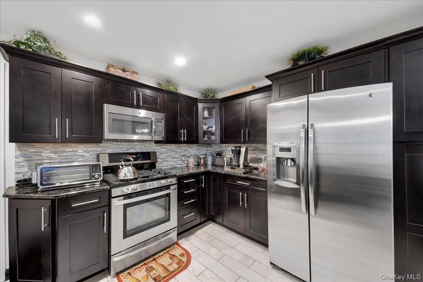 WELCOME HOME!! This charming brick Cape Cod with - photo 18