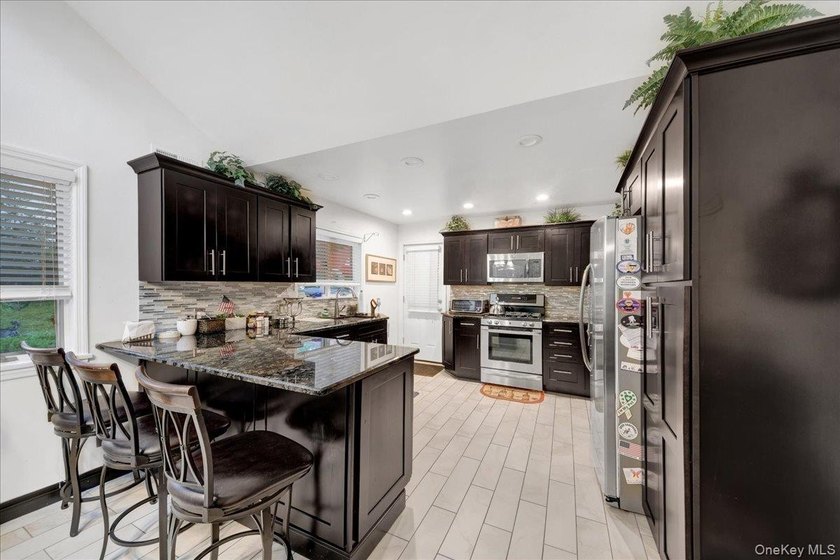 WELCOME HOME!! This charming brick Cape Cod with - photo 21