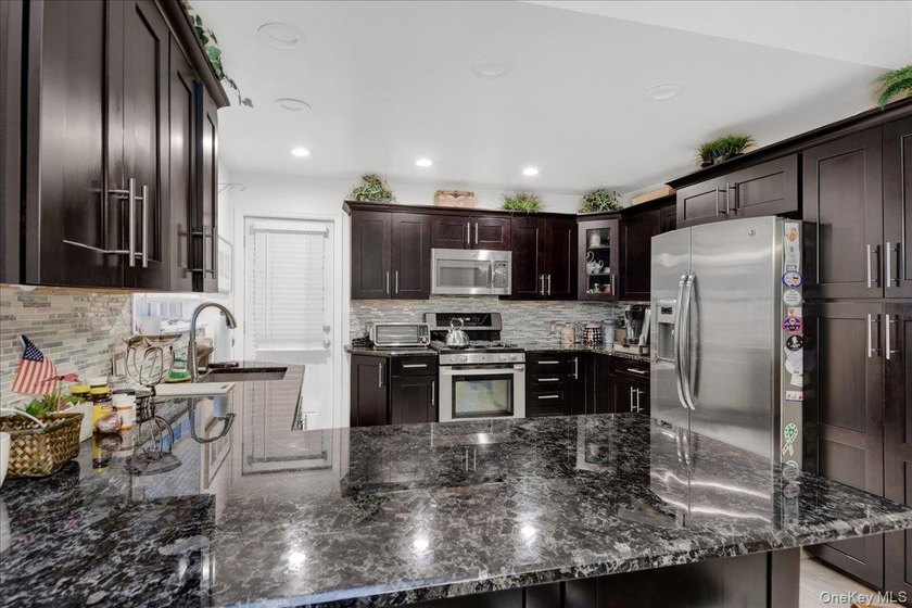 WELCOME HOME!! This charming brick Cape Cod with - photo 22
