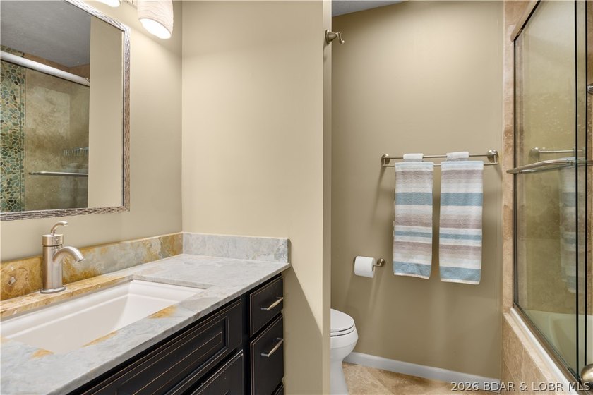 Experience tranquil lakeside living in this luxurious 3BR/3BA - photo 28