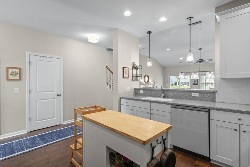 Four-bedroom, two-and-a-half-bathroom home with pond views and a - photo 17