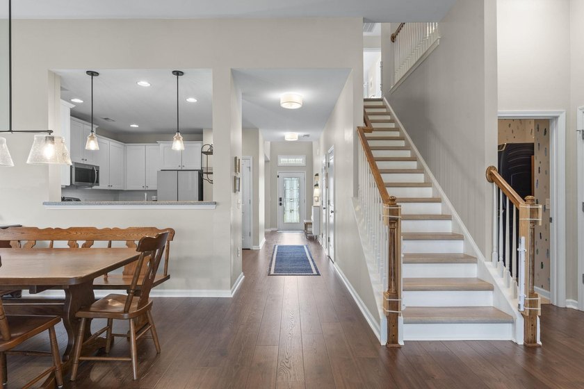 Four-bedroom, two-and-a-half-bathroom home with pond views and a - photo 24