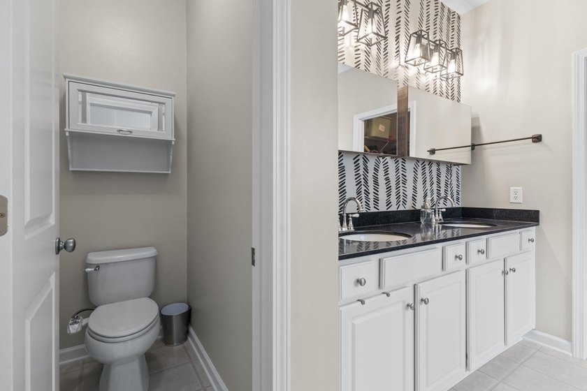 Four-bedroom, two-and-a-half-bathroom home with pond views and a - photo 32