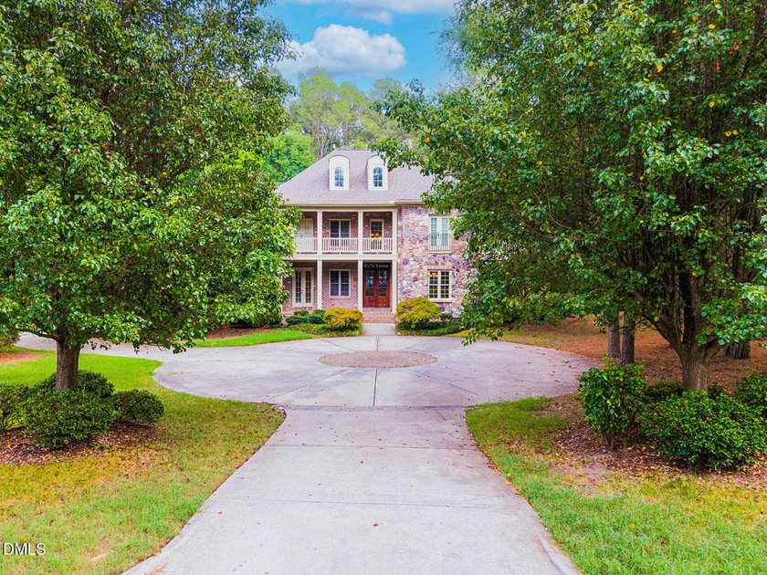 Nestled on a private, acre-plus, cul-de-sac homesite within the - photo 3