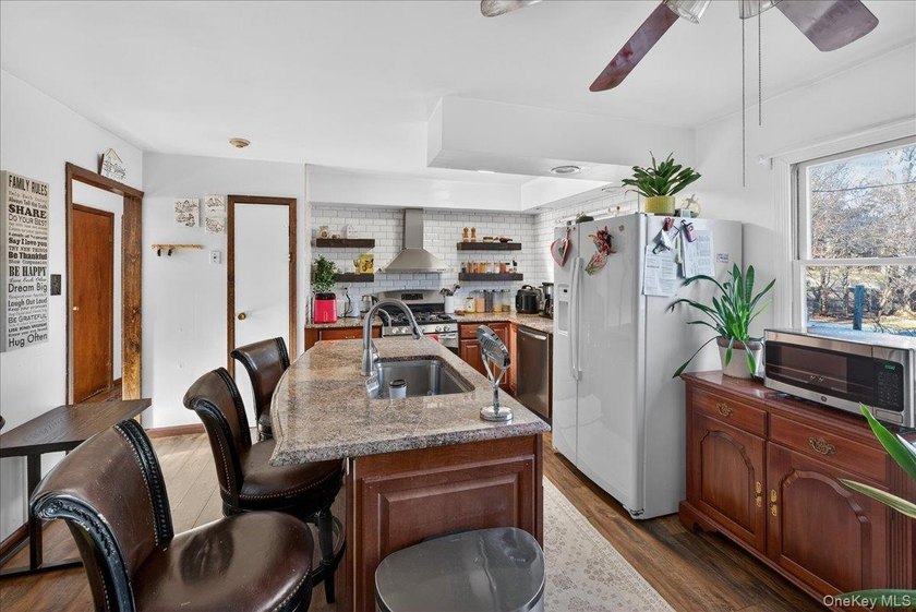 Welcome to this spacious and versatile home set on an oversized - photo 5