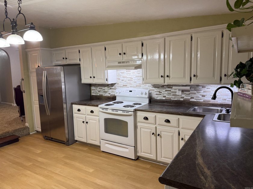 Welcome home to this charming 4-bedroom, 2-bath home nestled in - photo 18