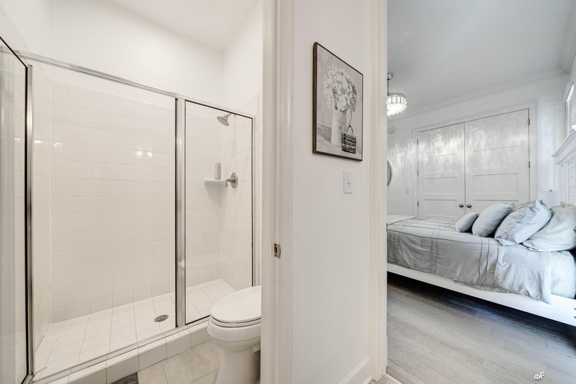 This extraordinary waterfront end unit condo, nestled in the - photo 28