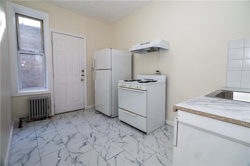 Great opportunity to own a legal 3-family brick house in the - photo 31
