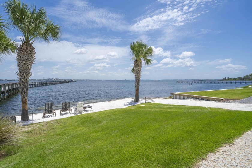 This extraordinary waterfront end unit condo, nestled in the - photo 40
