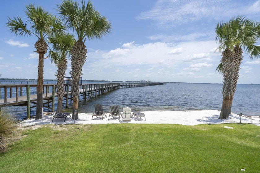 This extraordinary waterfront end unit condo, nestled in the - photo 41