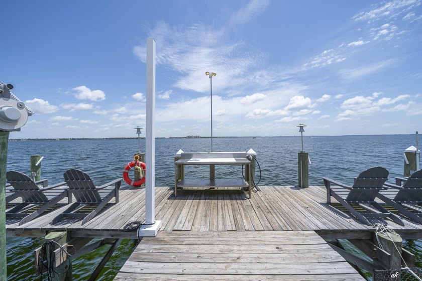 This extraordinary waterfront end unit condo, nestled in the - photo 42