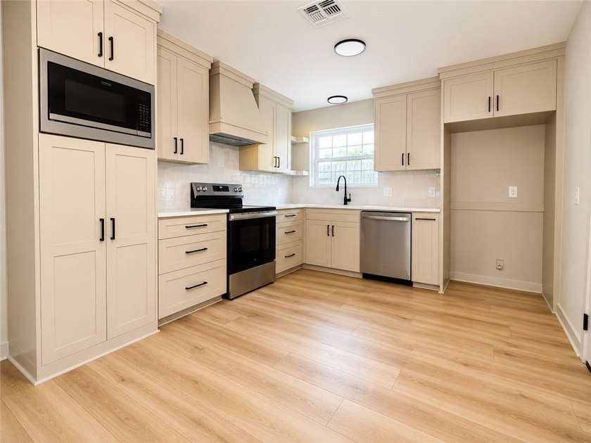 Welcome to your beautifully remodeled dream home in one of - photo 3